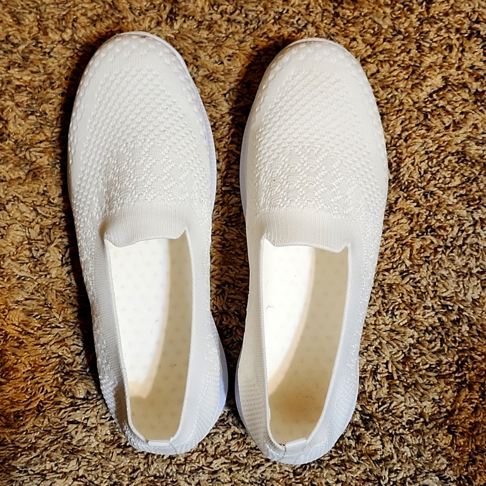 White flexible soft whit mesh shoes.